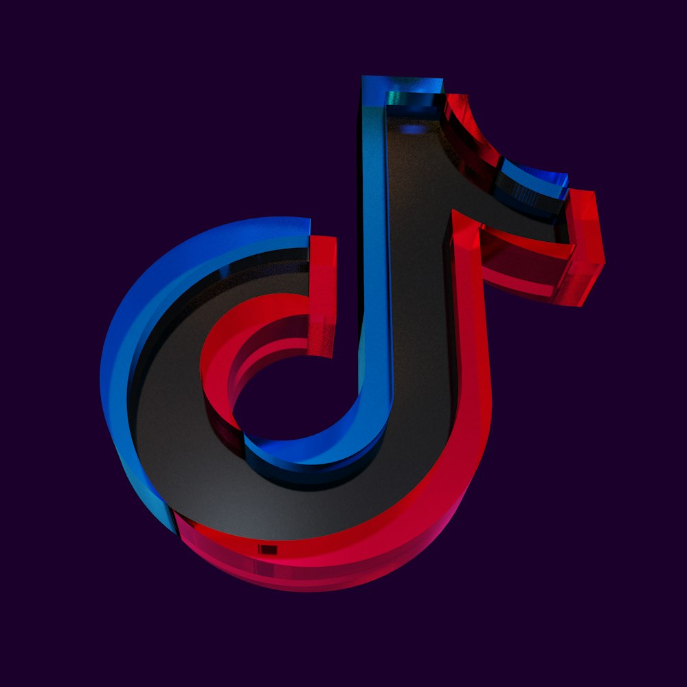 Un'immagine 3D della lettera J in rosso, bianco e blu