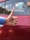 A satisfied customer giving a thumbs up in front of their home.