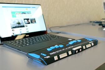 a laptop computer sitting on top of a desk