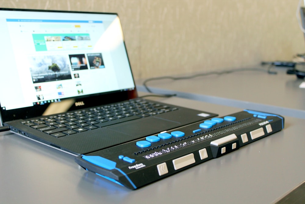 a laptop computer sitting on top of a desk