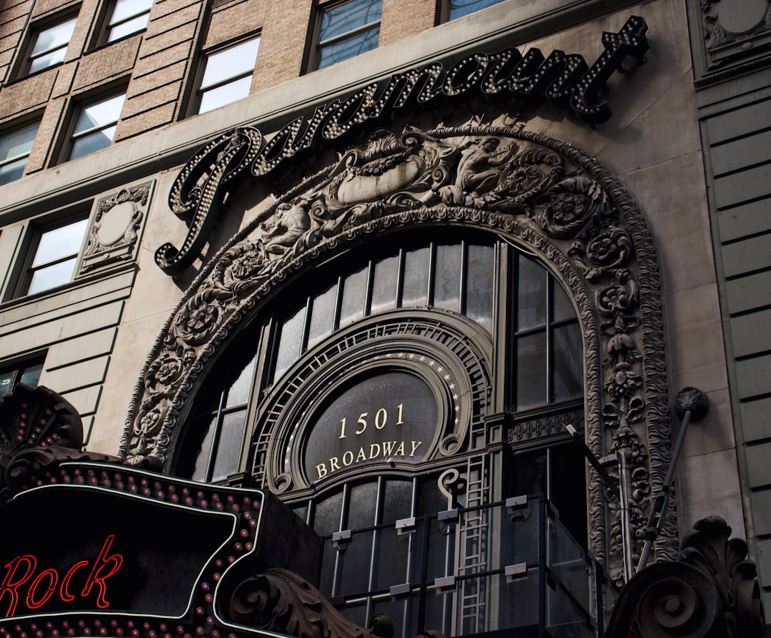 the entrance to a building with a clock on it,