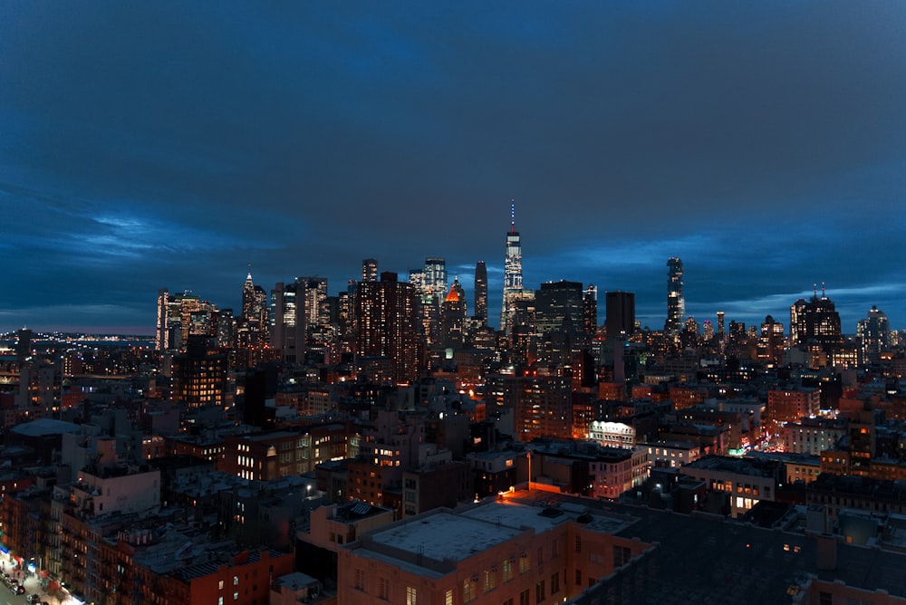 a view of a city at night from the top of a building