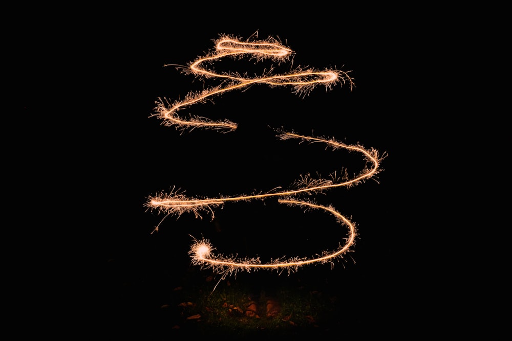 a long exposure of a sparkler in the dark