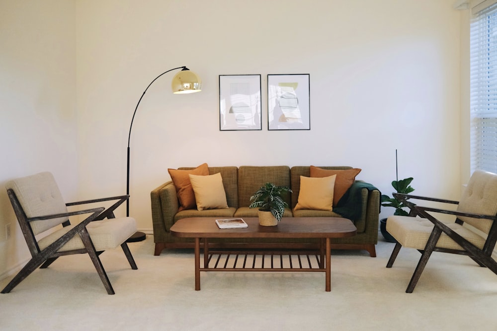 a living room filled with furniture and a lamp