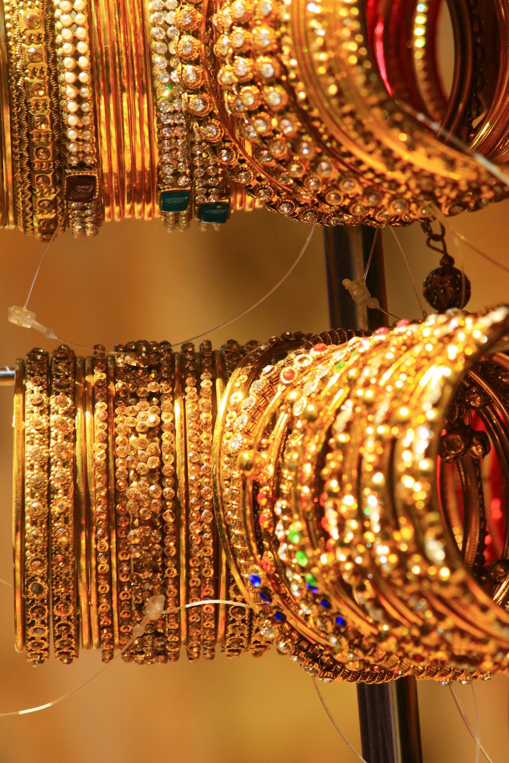 a bunch of bracelets are hanging on a rack