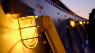 A vintage ship light with weathered metal and glass, evoking maritime history.