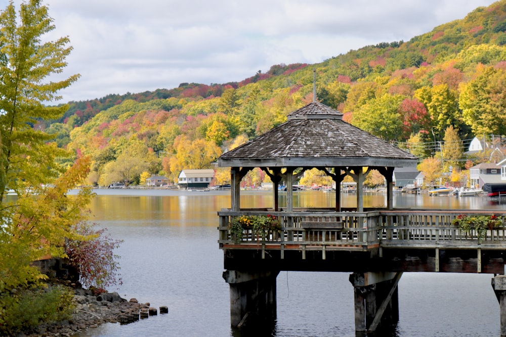 a gazebo sitting on top of a wooden pier