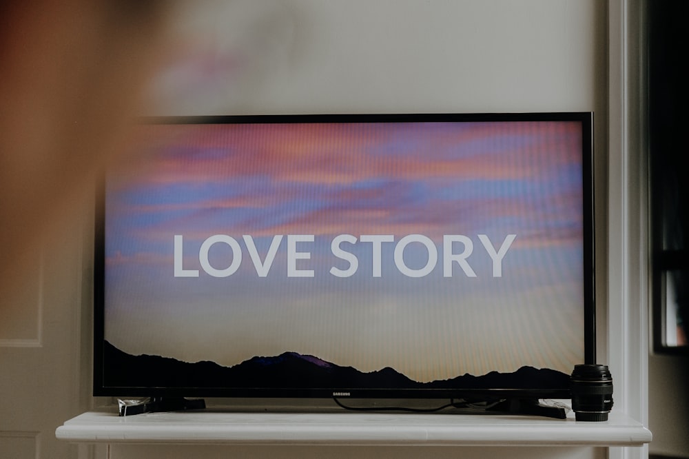 a television screen with the words love story on it