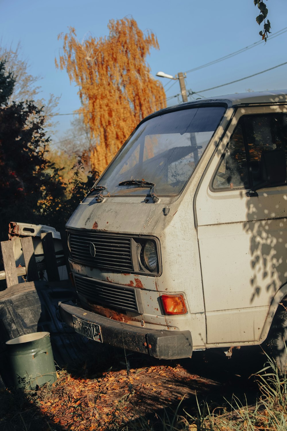 an old van is parked in a field