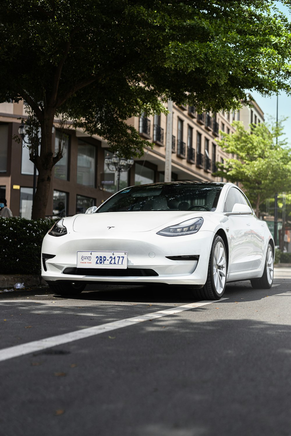 a white car parked on the side of the road