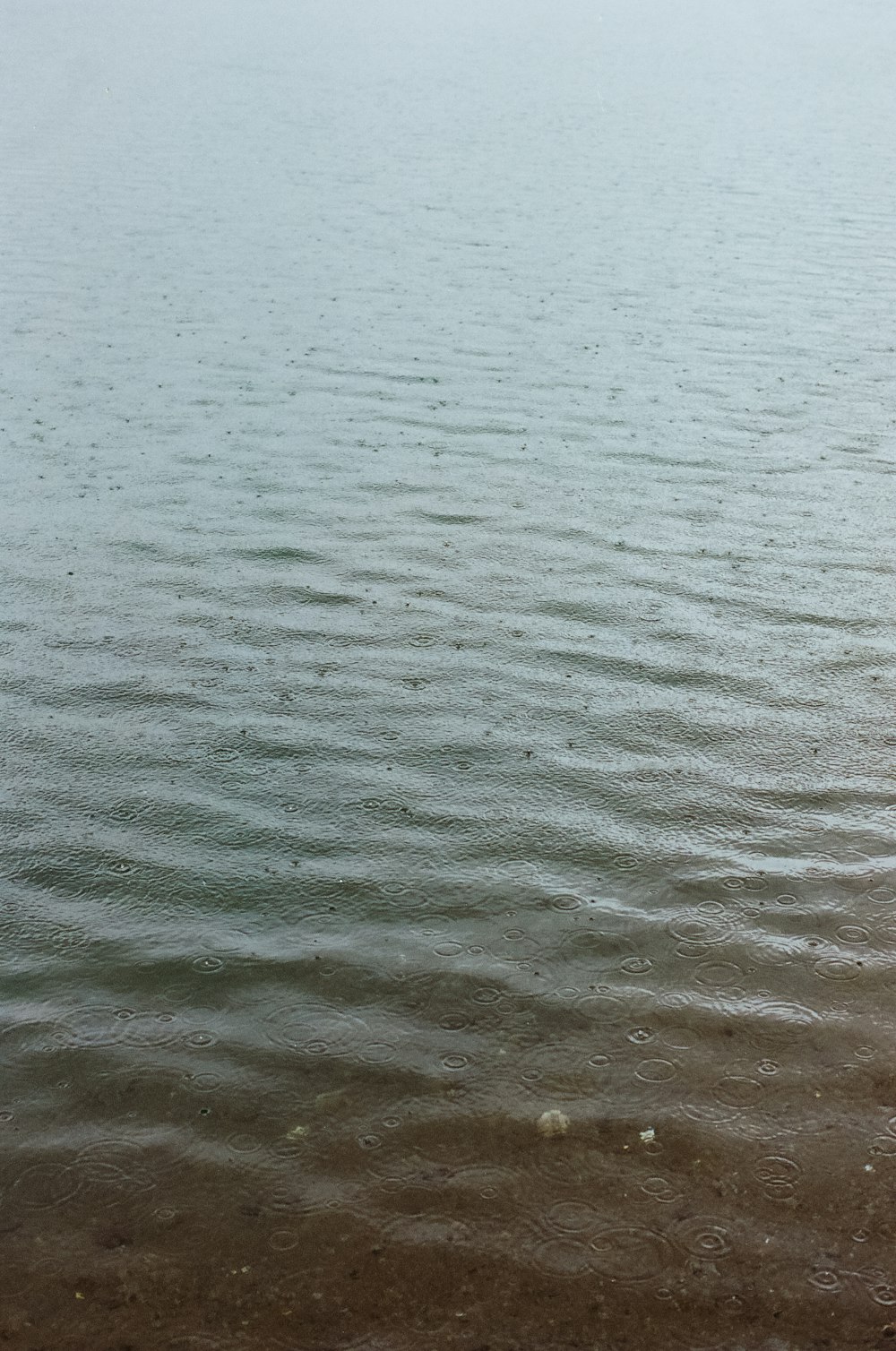 a boat floating on top of a large body of water