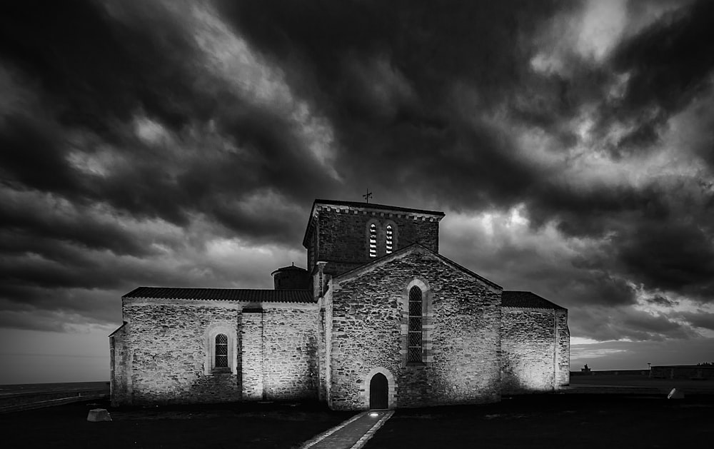 a black and white photo of an old church