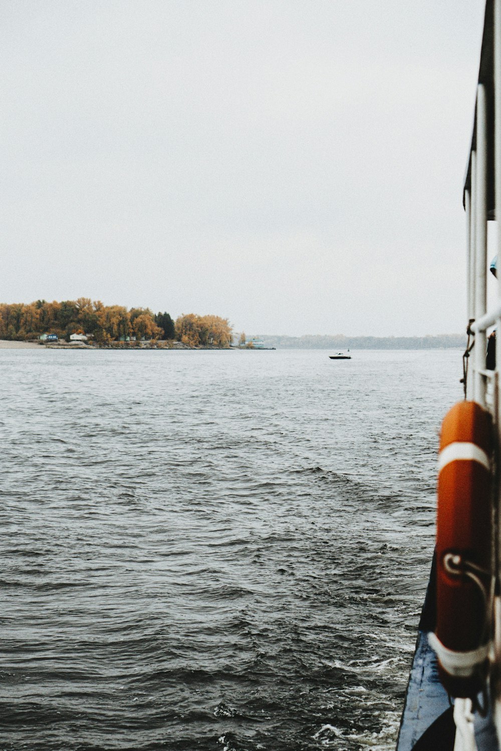 a boat traveling across a large body of water