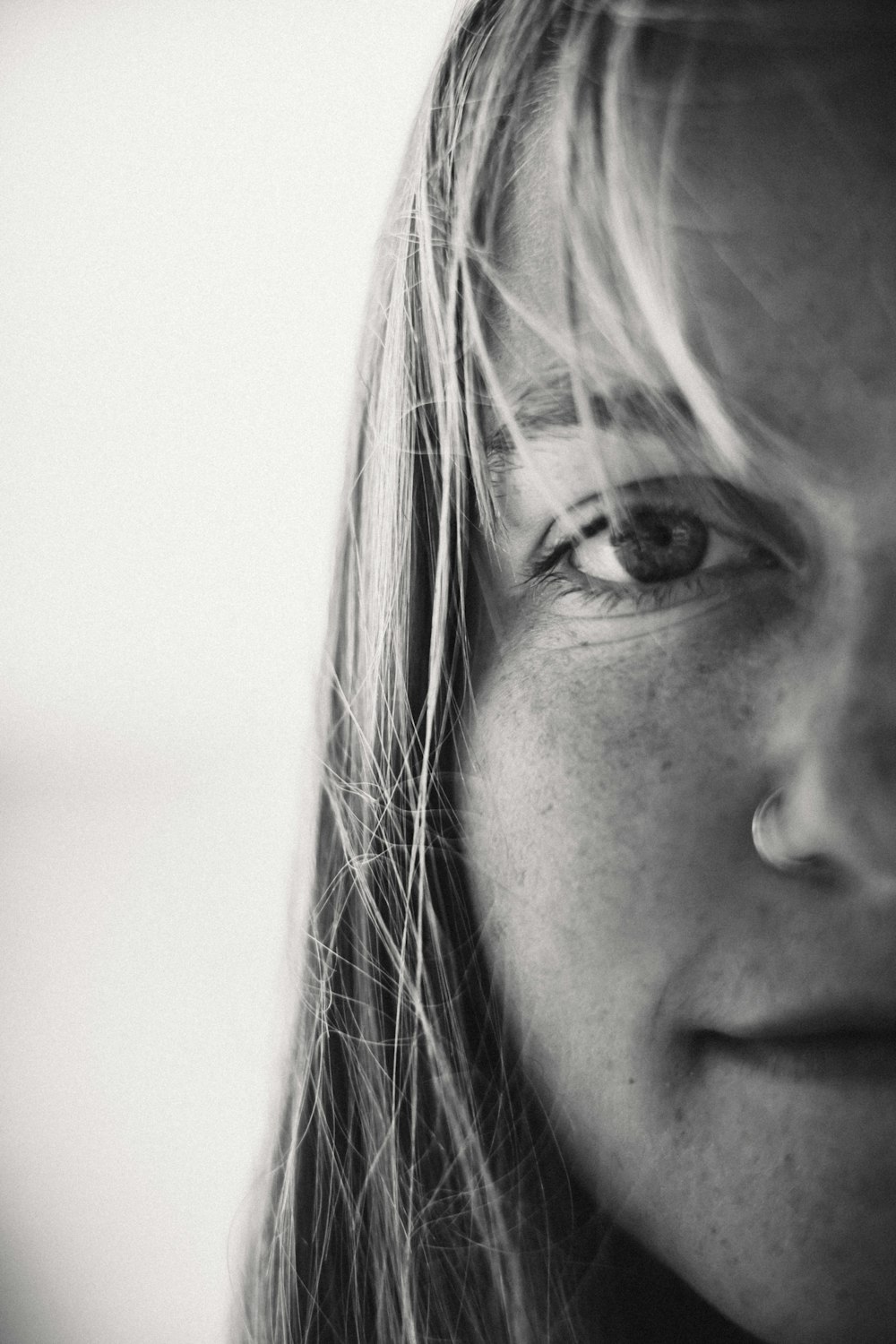 a black and white photo of a woman's face