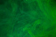 a green background with a lot of smoke
