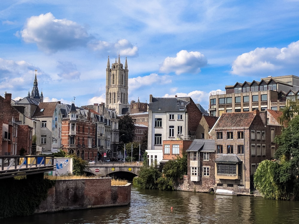 a river running through a city next to tall buildings