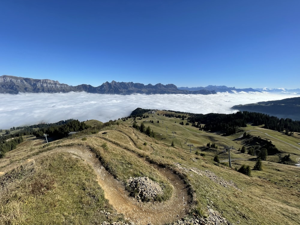 a view of a mountain with a trail going up the side of it