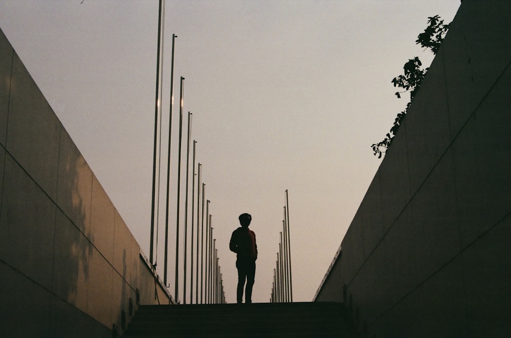 a person standing on a set of stairs