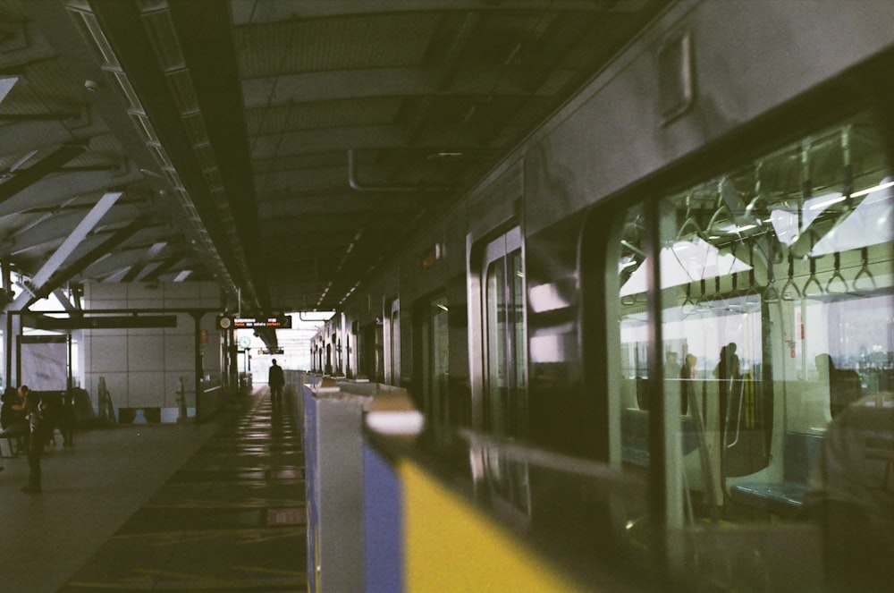 a train parked at a train station next to a loading platform