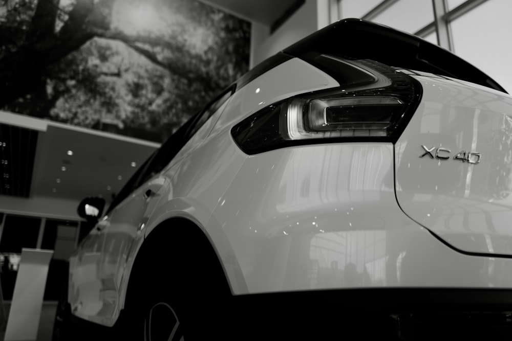 a car parked in front of a mirror posing for the camera