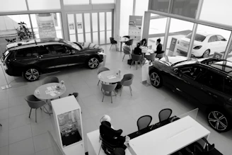 A friendly customer service representative ready to assist with car inquiries.
