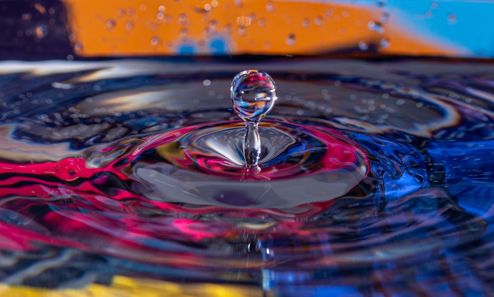 a drop of water that is floating in the air