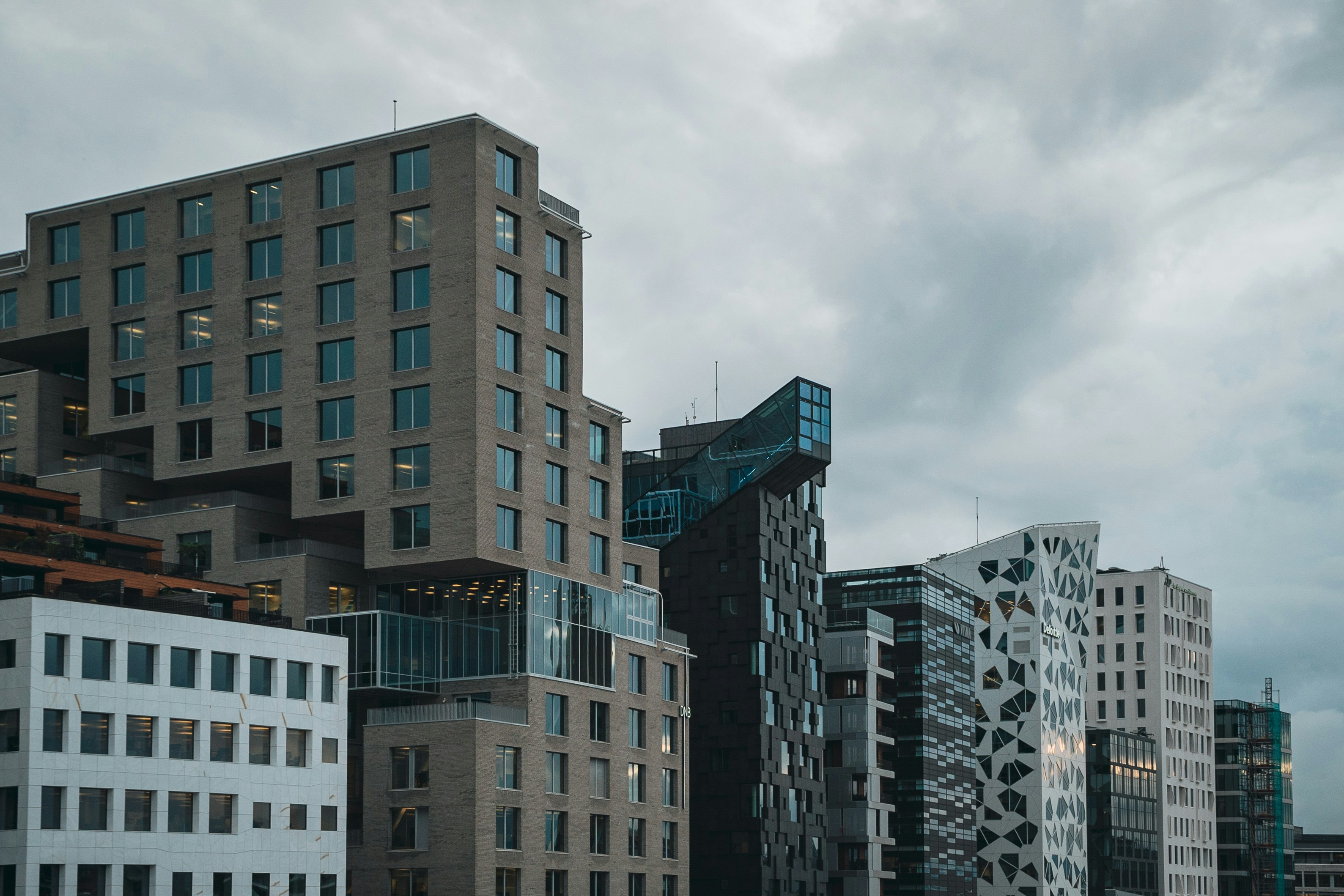 a group of tall buildings sitting next to each other