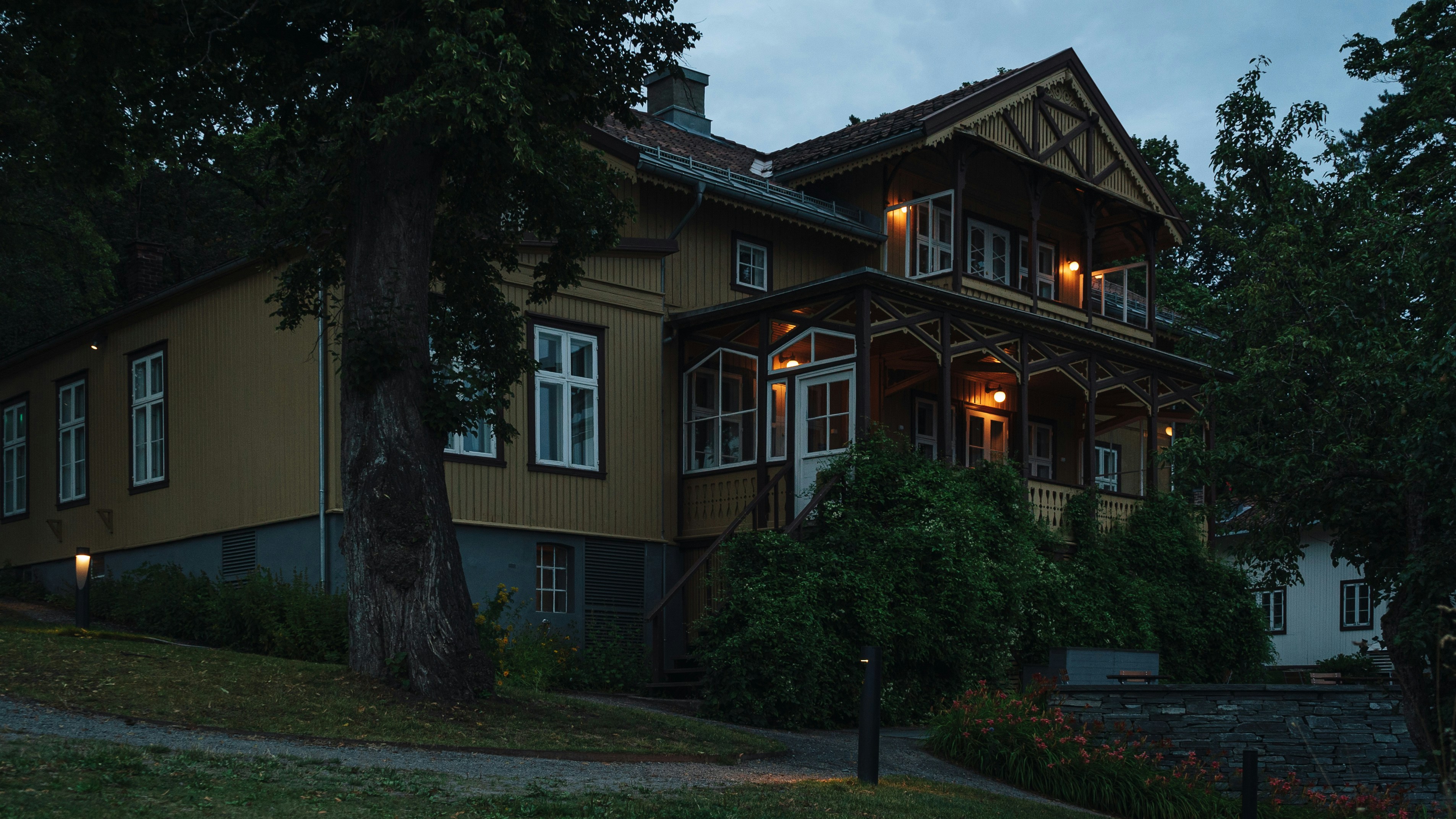 a large brown house with a lot of windows