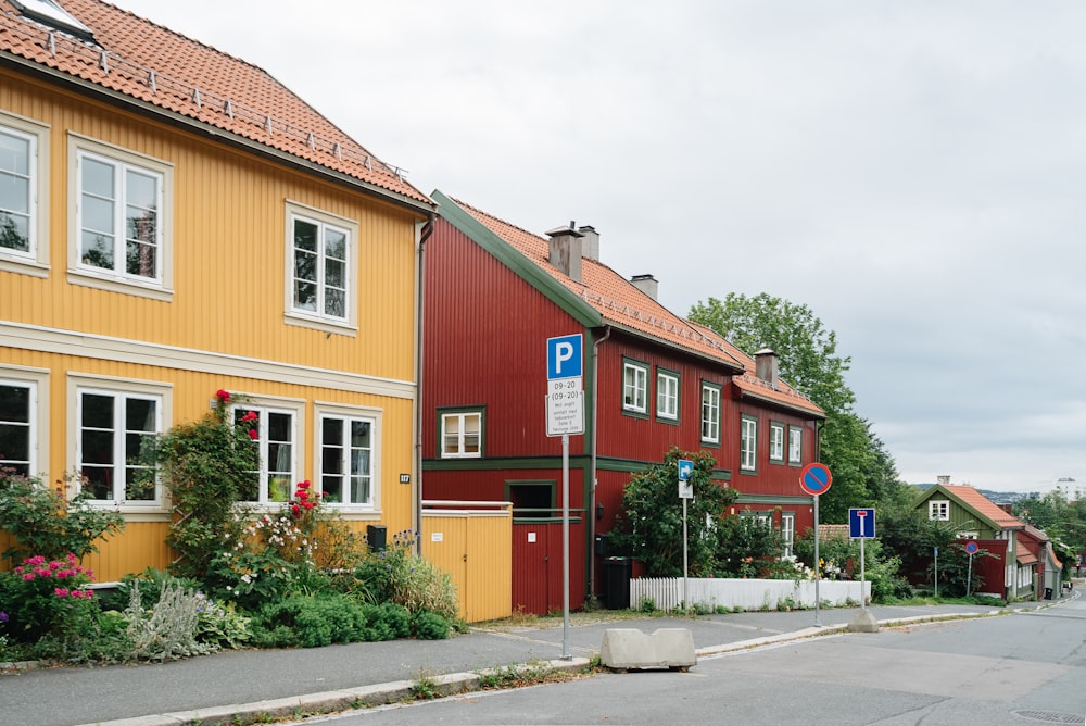 a row of houses with a street sign in front of them