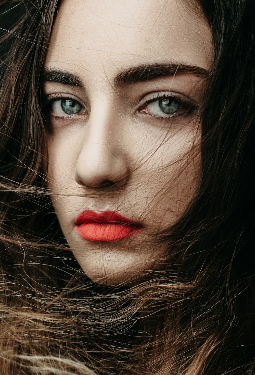 a close up of a woman with long hair