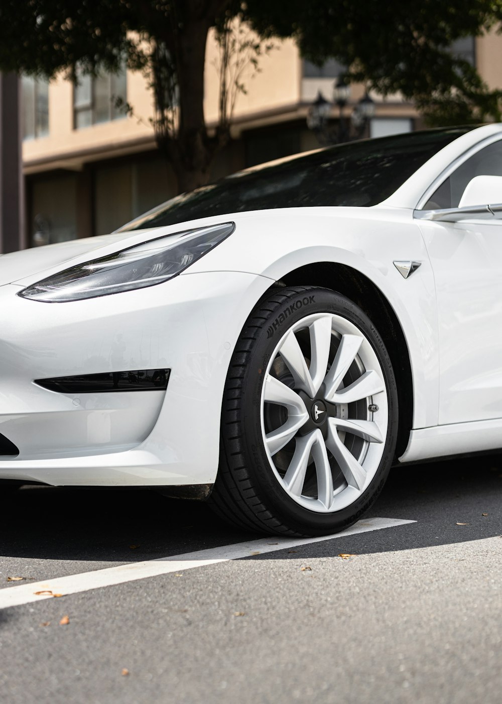 a white car parked on the side of the road