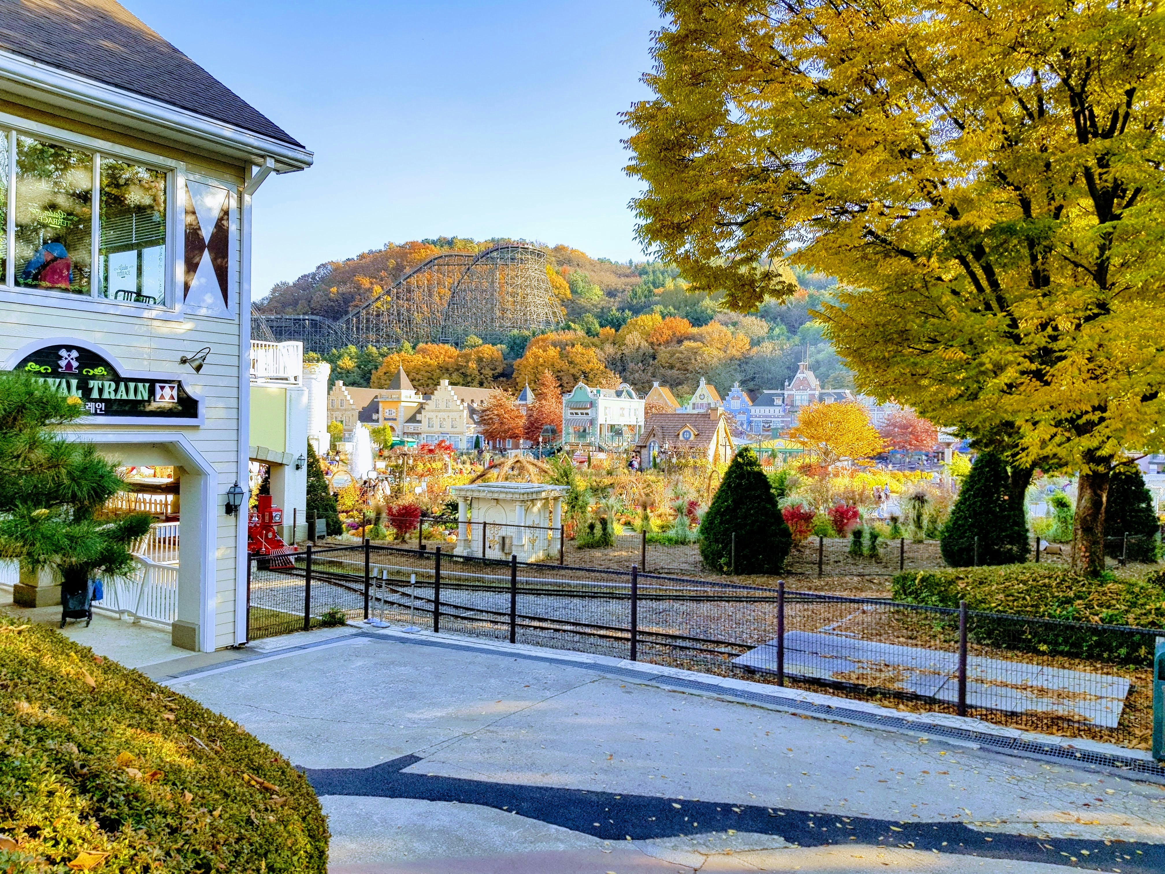 a scenic view of a small town in the fall