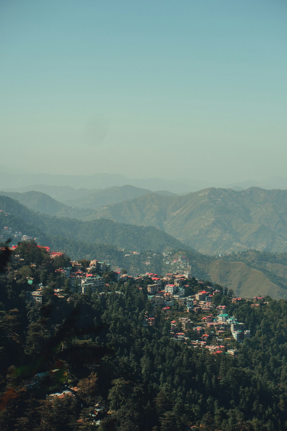 a view of a town in the mountains