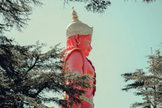 a large statue of a person with a crown on top of it