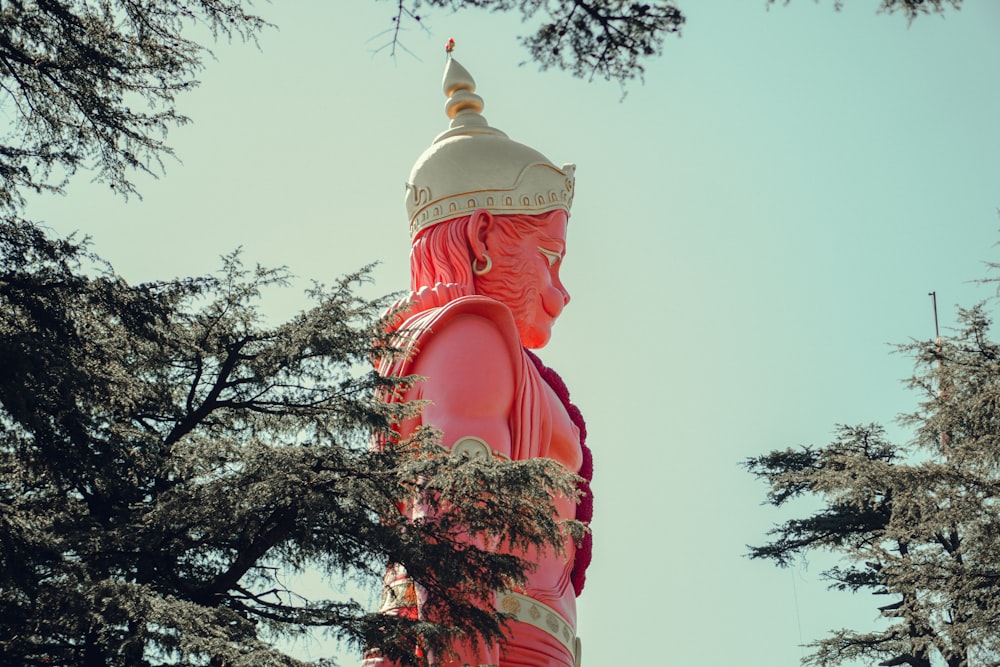 a large statue of a person with a crown on top of it