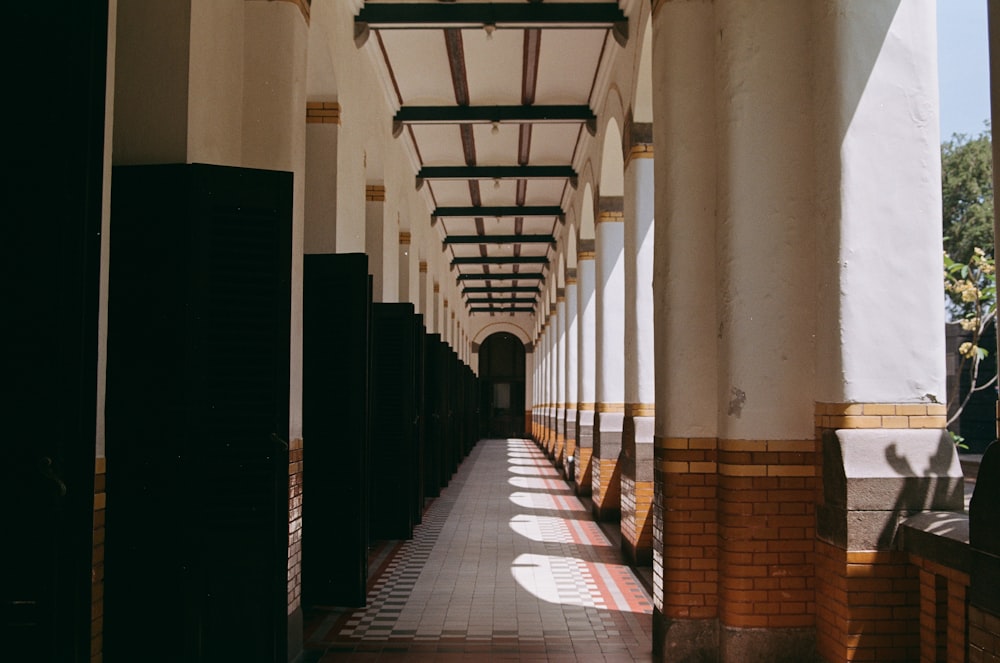 a long hallway with a tiled floor and walls