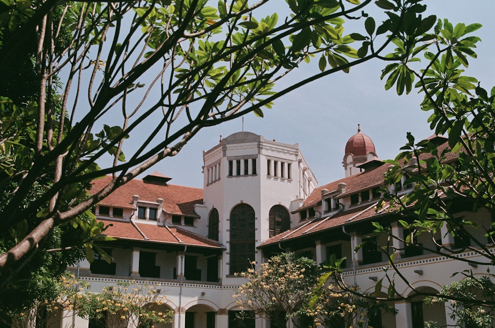 a large white building with a clock tower