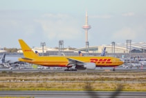 a large jetliner sitting on top of an airport runway