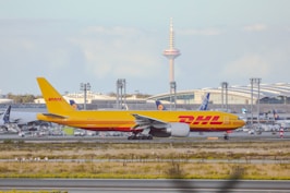 a large jetliner sitting on top of an airport runway