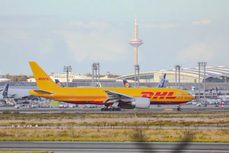a large jetliner sitting on top of an airport runway