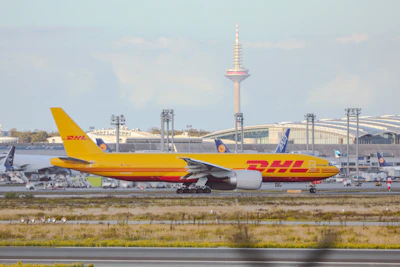a large jetliner sitting on top of an airport runway