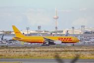 a large jetliner sitting on top of an airport runway