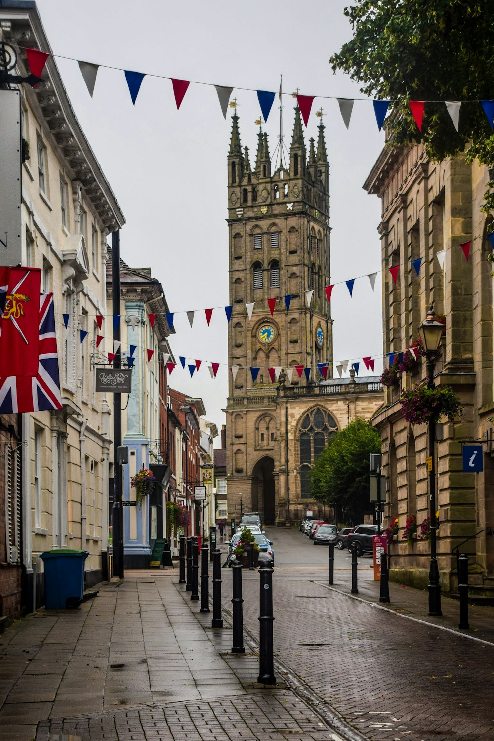 a city street with a clock tower in the background