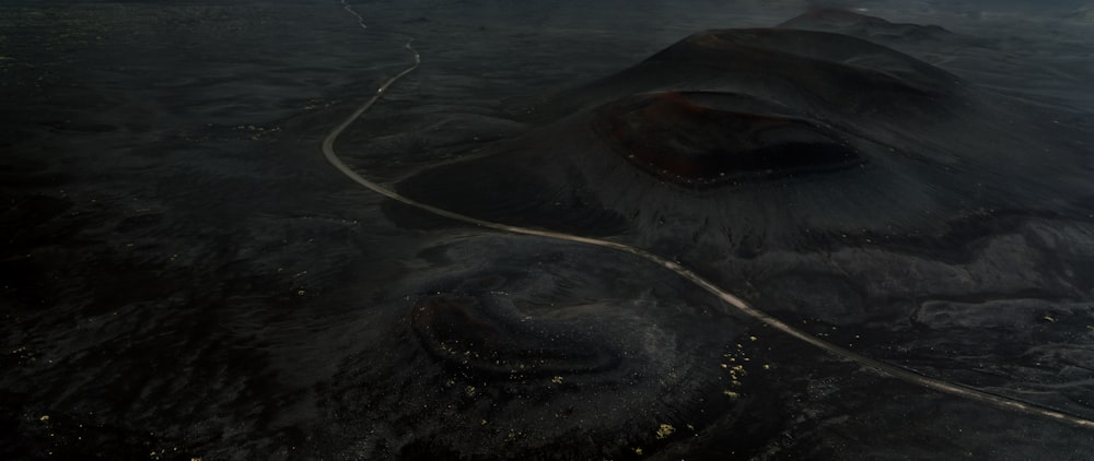 an aerial view of a volcano in the middle of the night