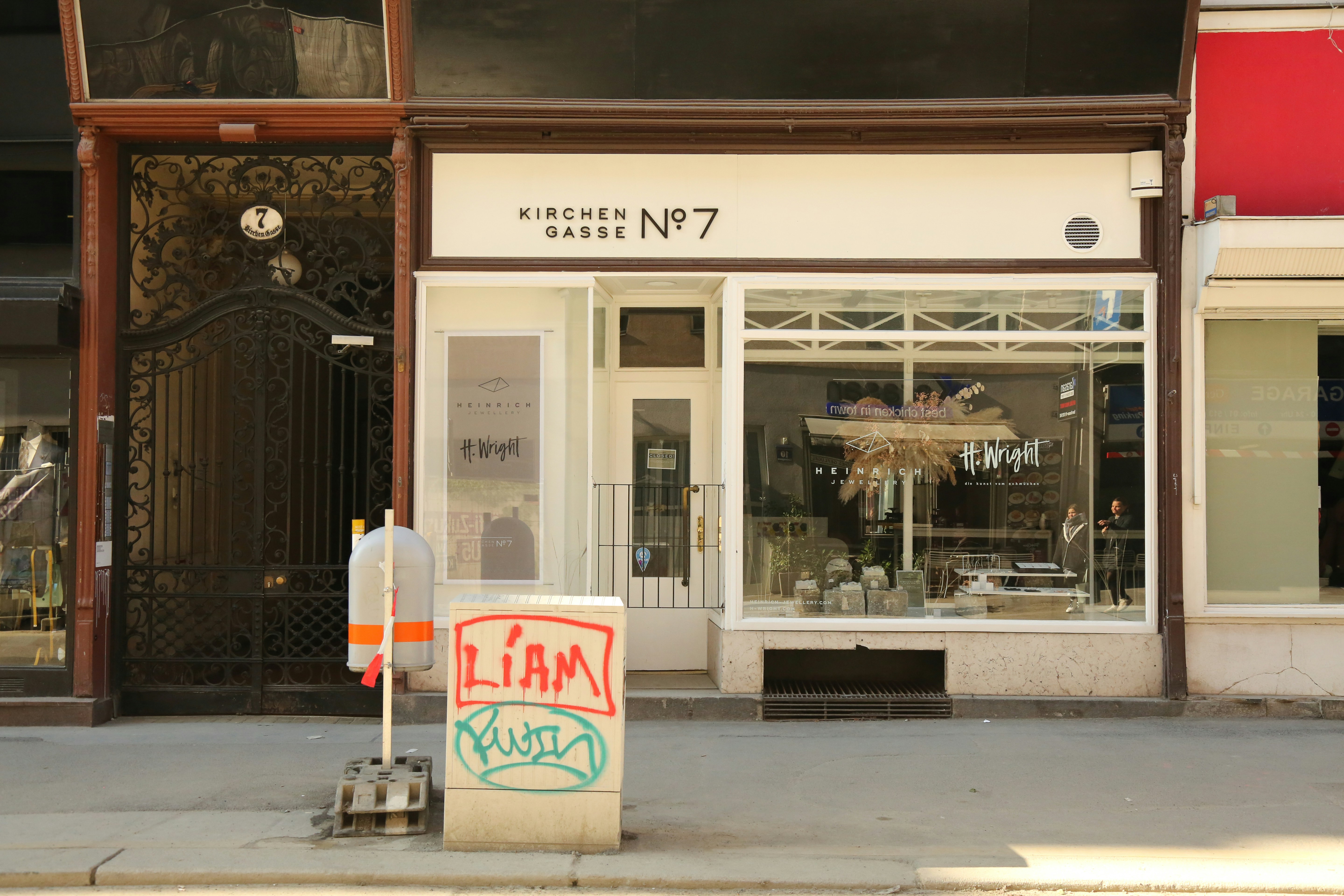 a street corner with a store front and store windows