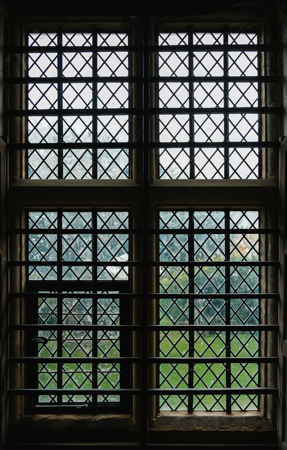 a view of a grassy field through a window