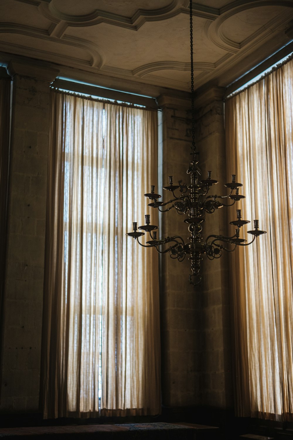 a chandelier hanging from a ceiling in a room