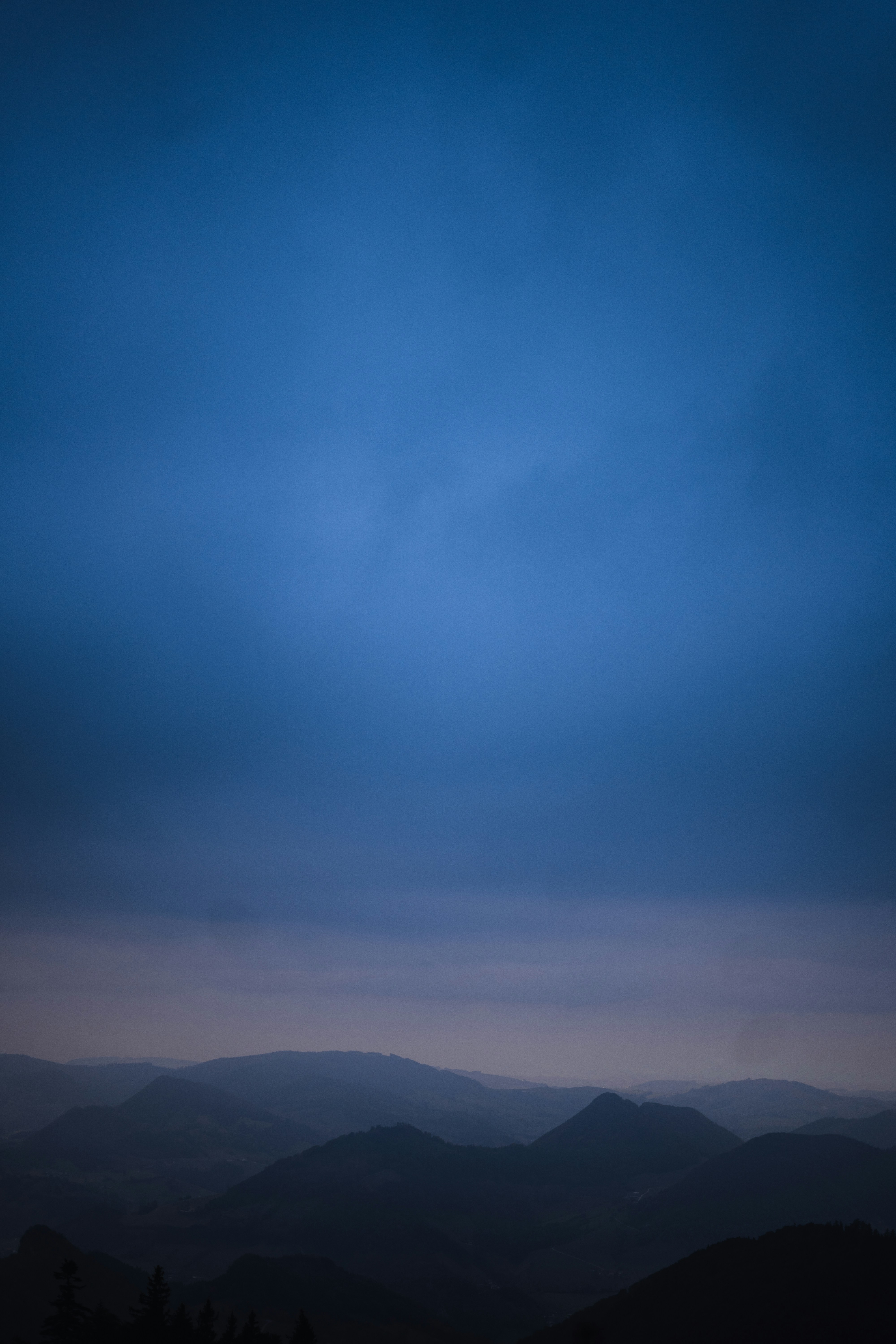 a view of a mountain range at dusk