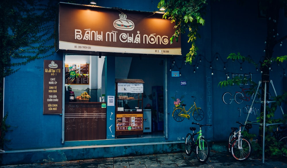 a bike is parked outside of a restaurant