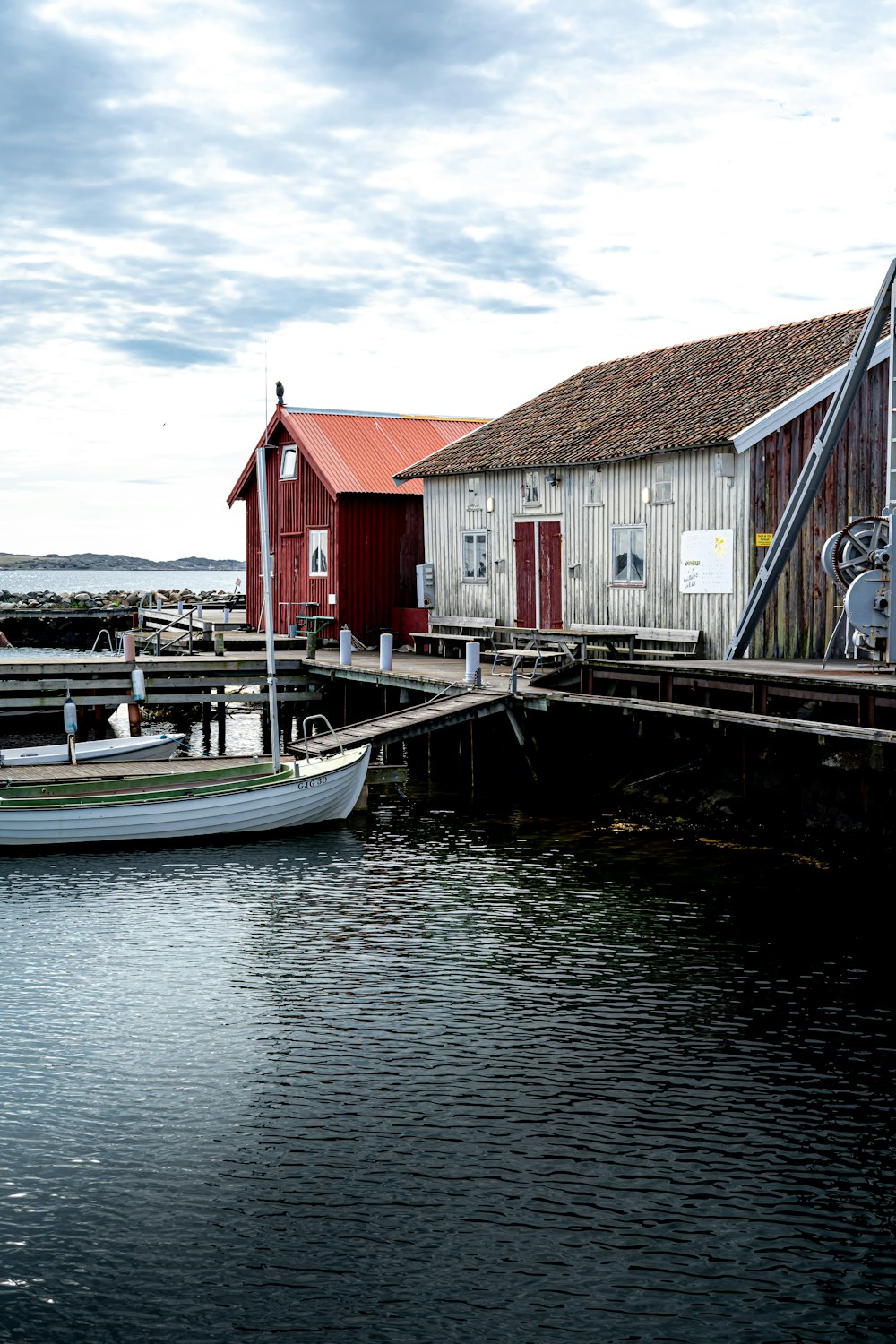 a small boat is docked at a dock